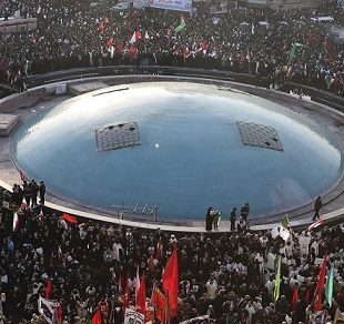 Mourners attend a funeral ceremony for Iranian Gen. Qassem Soleimani and his comrades, who were killed in Iraq in a U.S. drone strike on Friday, at the Enqelab-e-Eslami (Islamic Revolution) Sq. in Tehran, Iran, Monday, Jan. 6, 2020. (AP Photo/Ebrahim Noroozi)